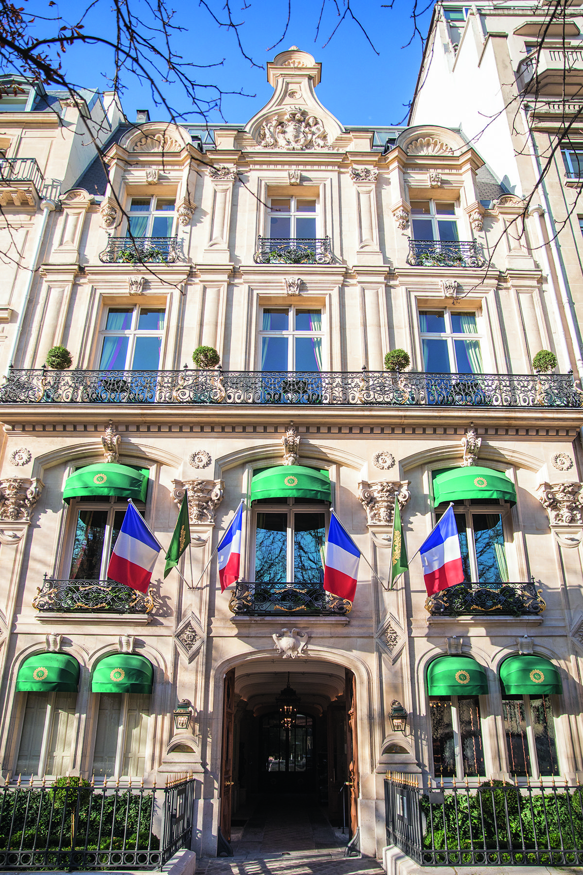 Domaine Clarence Dillon showcases its elegant facade with prominent green awnings.