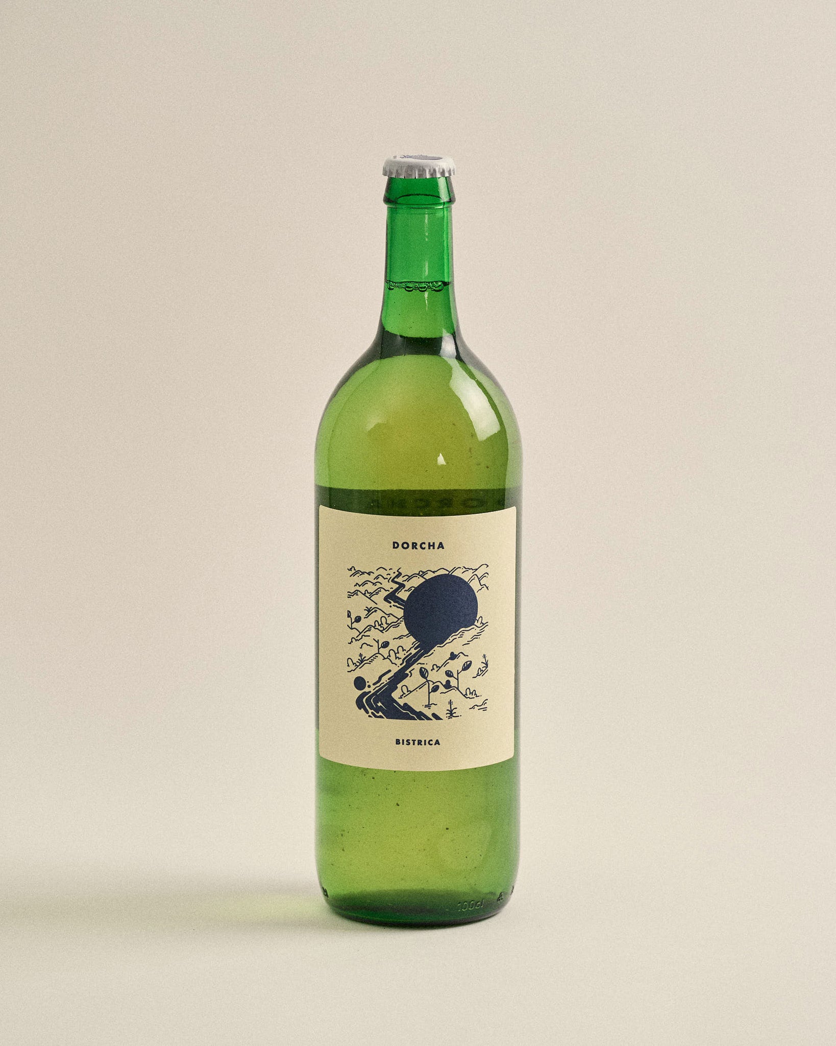 DORCHA BISTRICA green bottle with cream label featuring dark botanical illustration and sun motif
