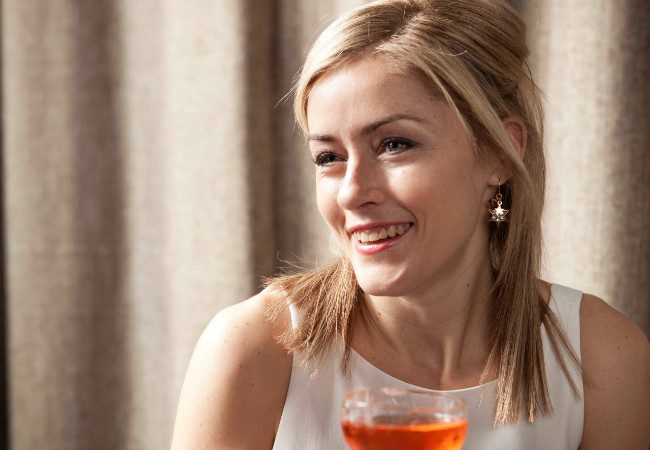 Charlotte Voisey holding a cocktail at the Spirited Awards ceremony or Tales of the Cocktail event.