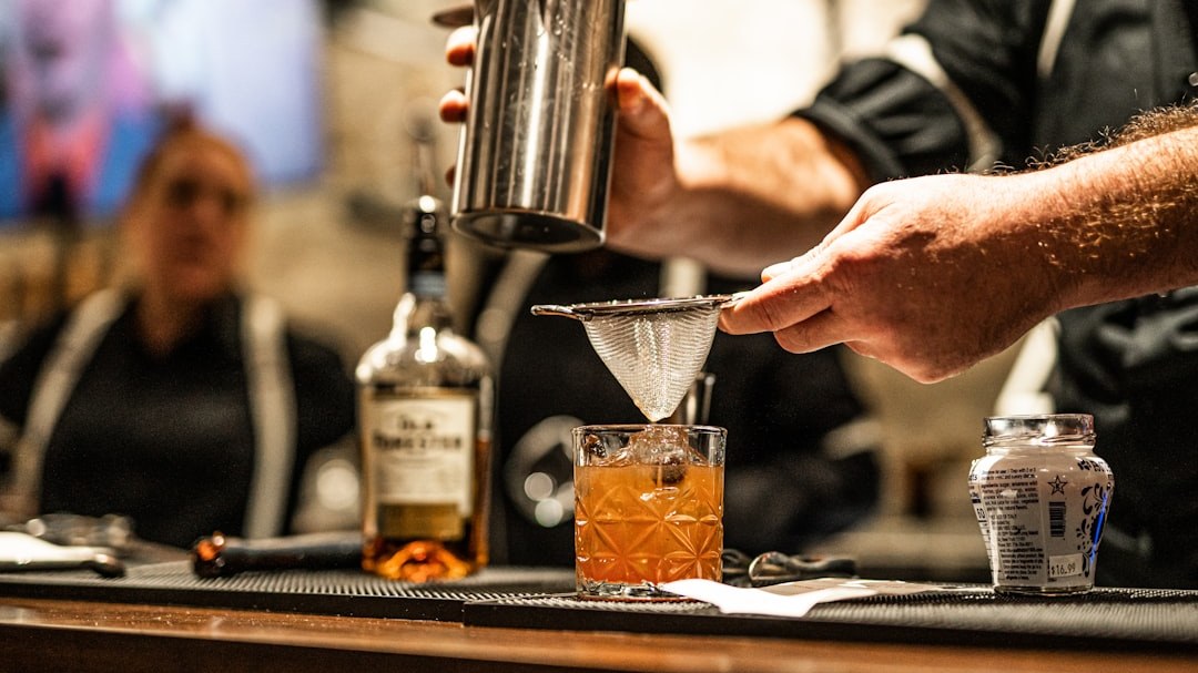 Bartender crafting a cocktail at a competition bar