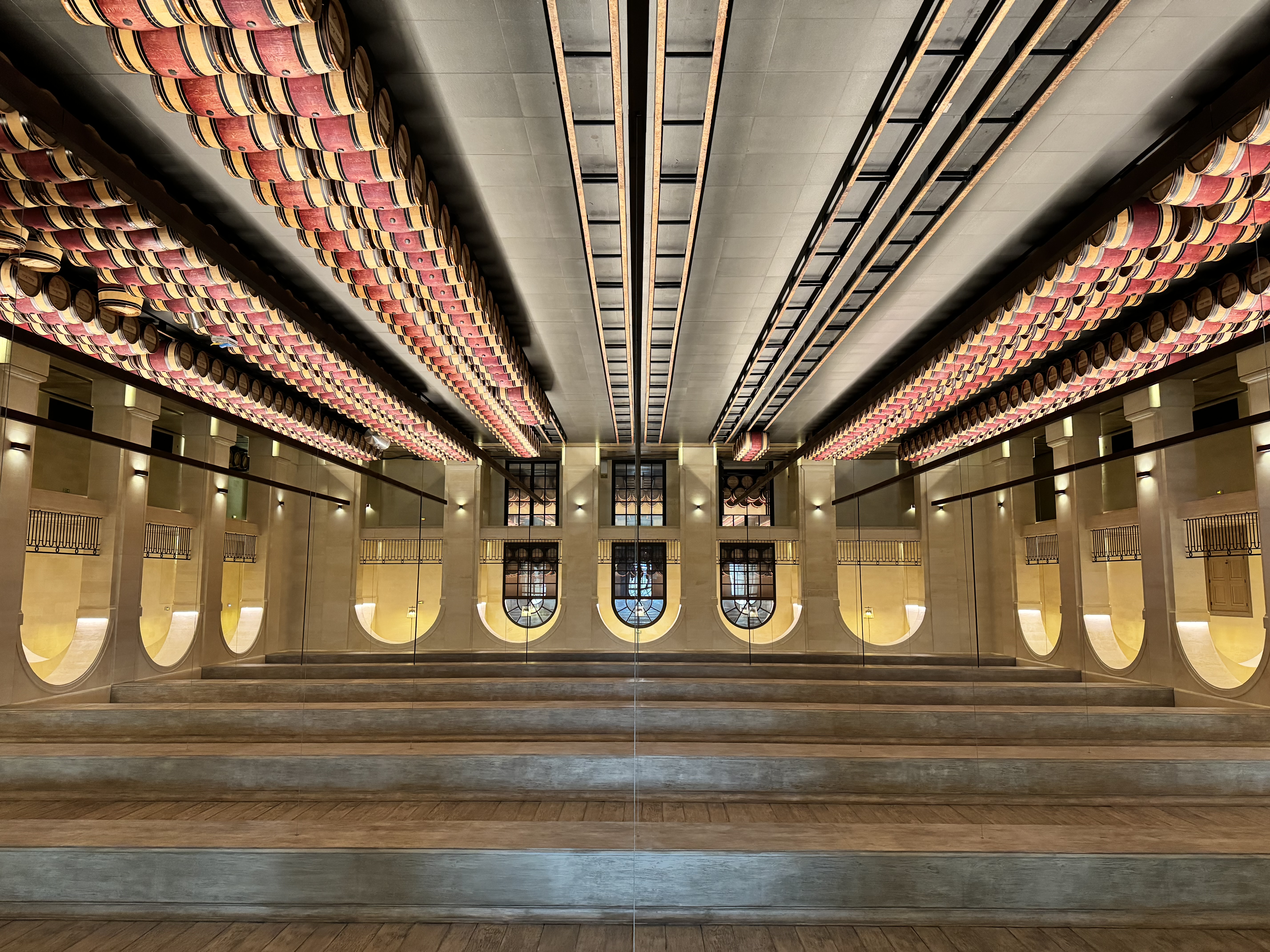 a long barrel room filled with red barrels