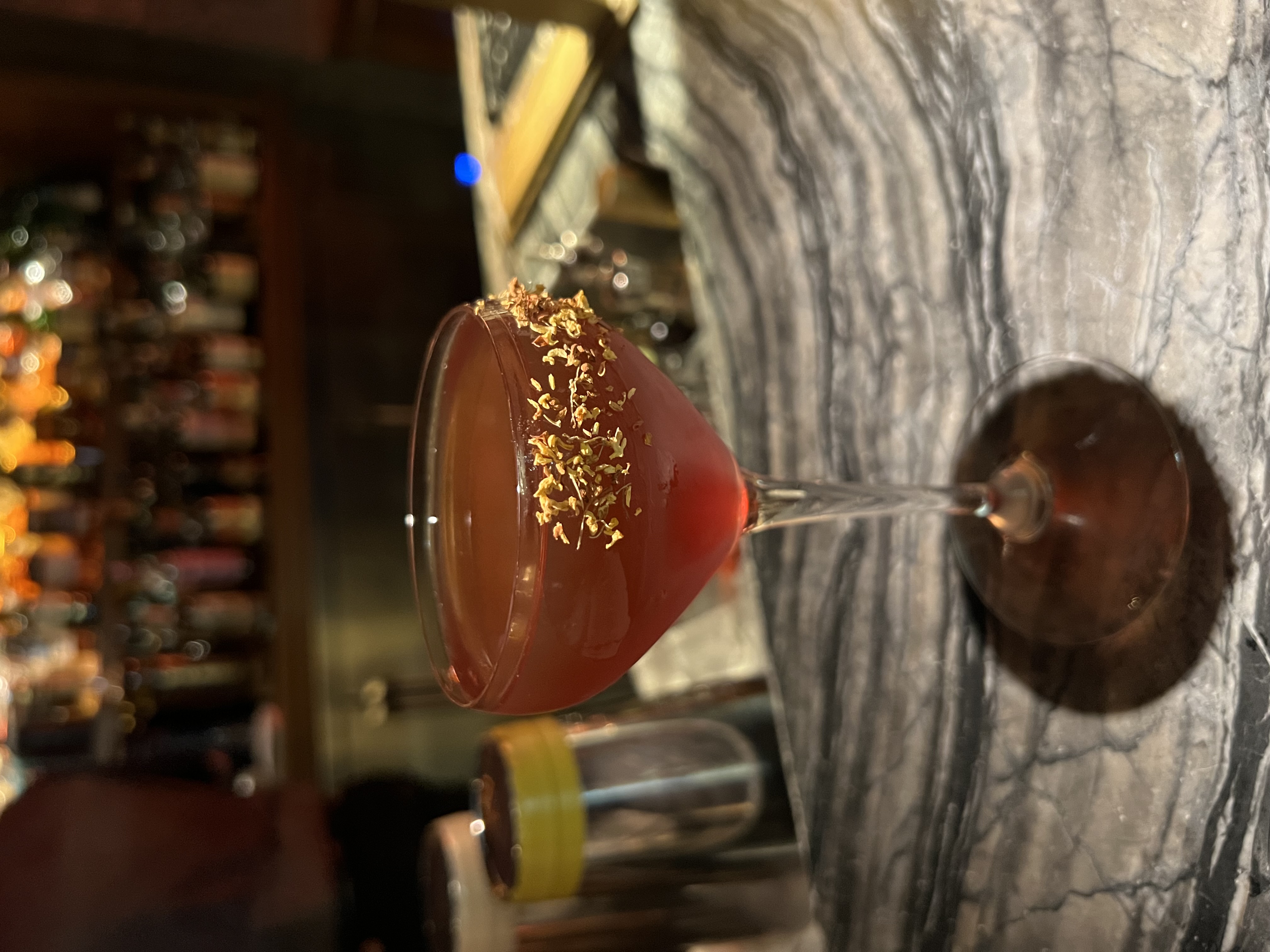 a cocktail served up at a bar