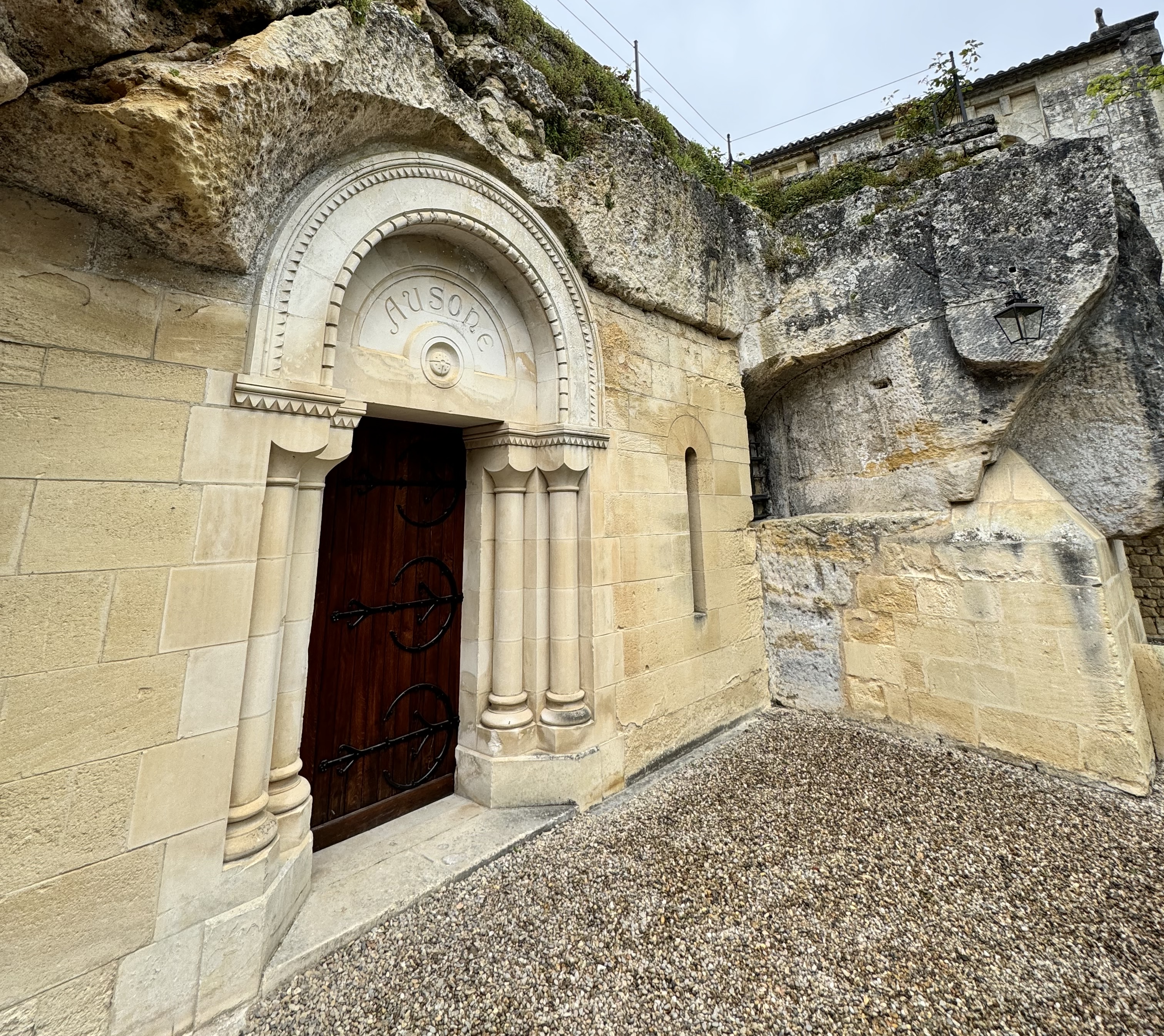 the entrance of a cave at a rock face