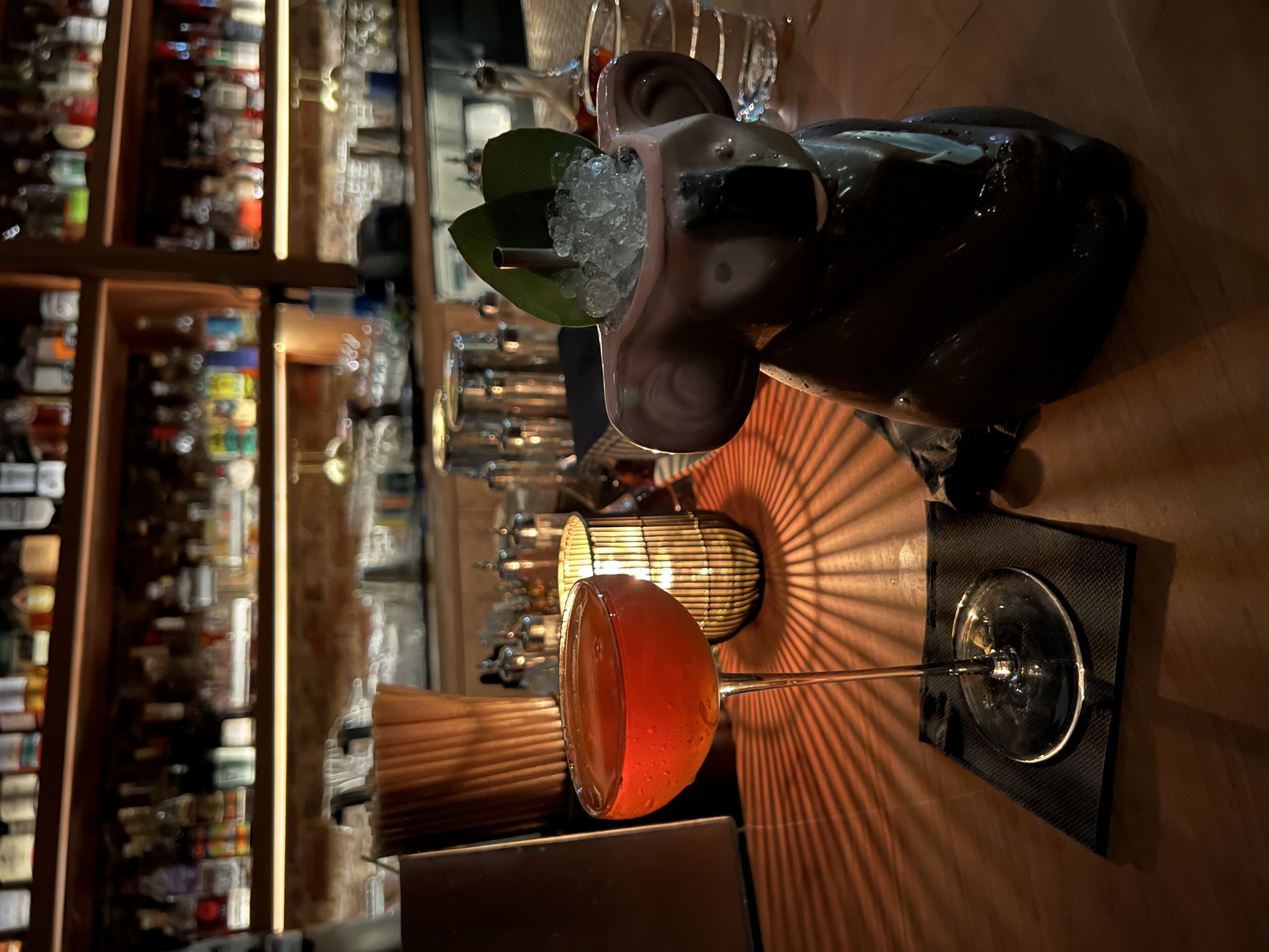 two cocktails on a bar