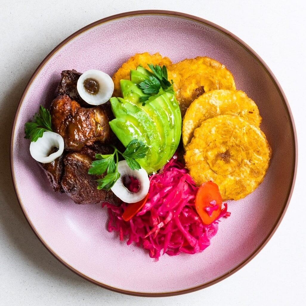 colorful plantain avocado and pork dish
