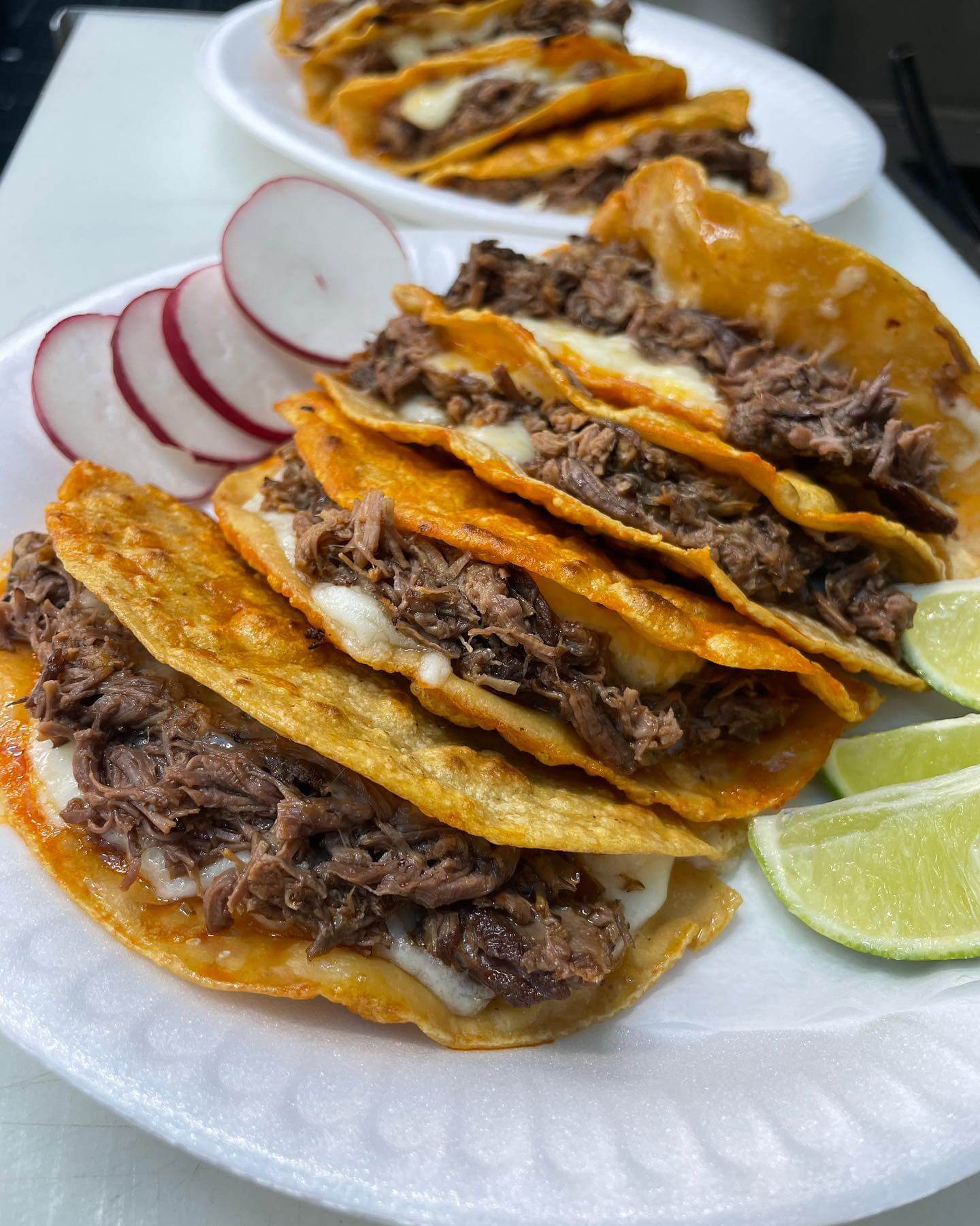 The juicy birria de res quesatacos at Tacos and Birria La UNica