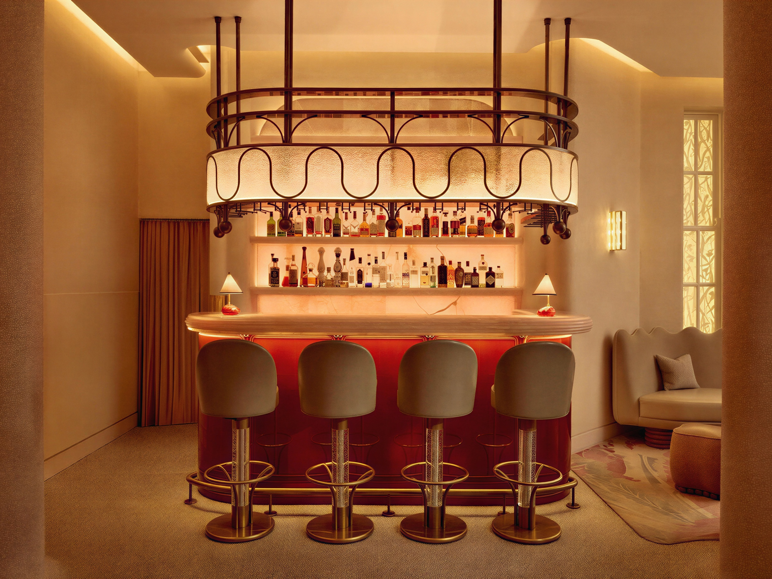 Chic bar with a glowing red counter, vintage barstools, backlit shelves of bottles, and soft lighting. Cozy seating in a warm-toned room.
