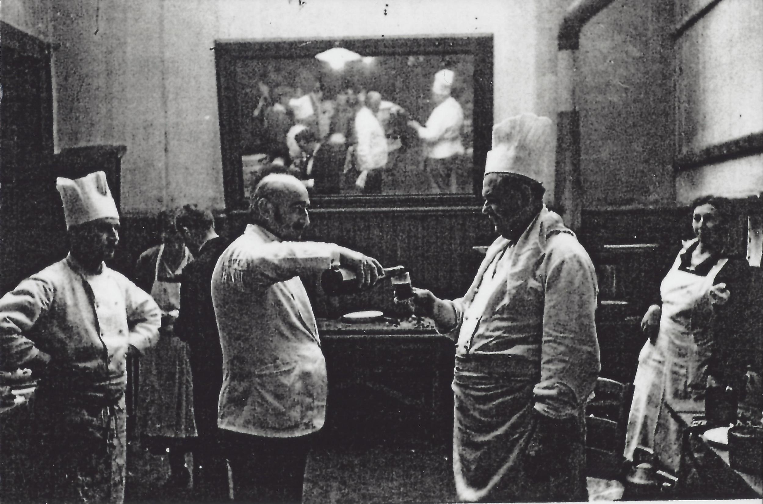 A winemaker pours a sample of his wine at La Paulée