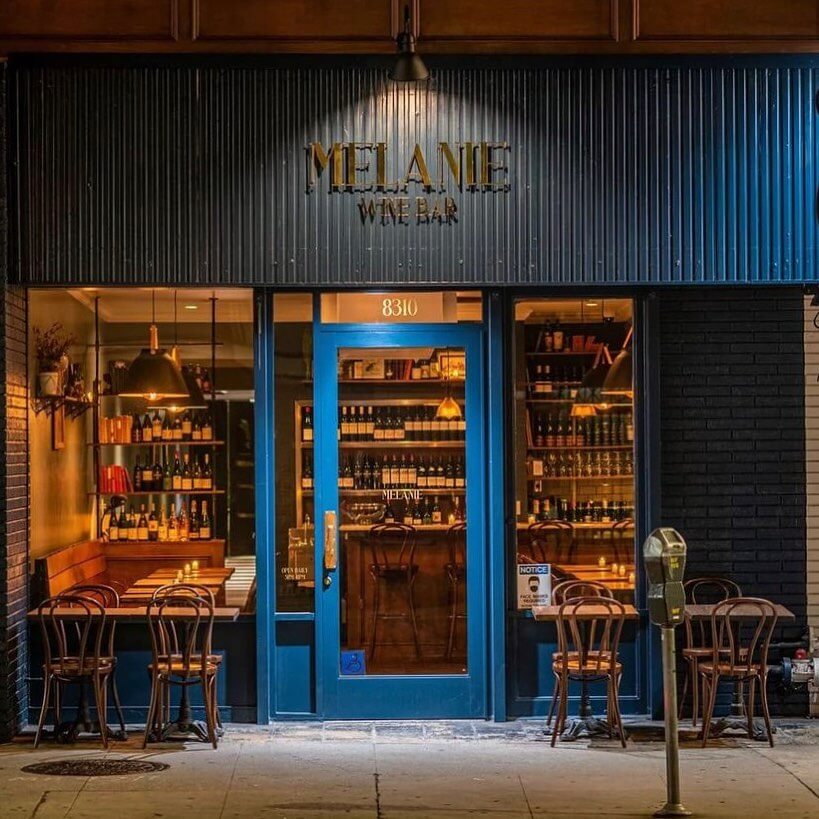 The exterior of Melanie Wine Bar at night