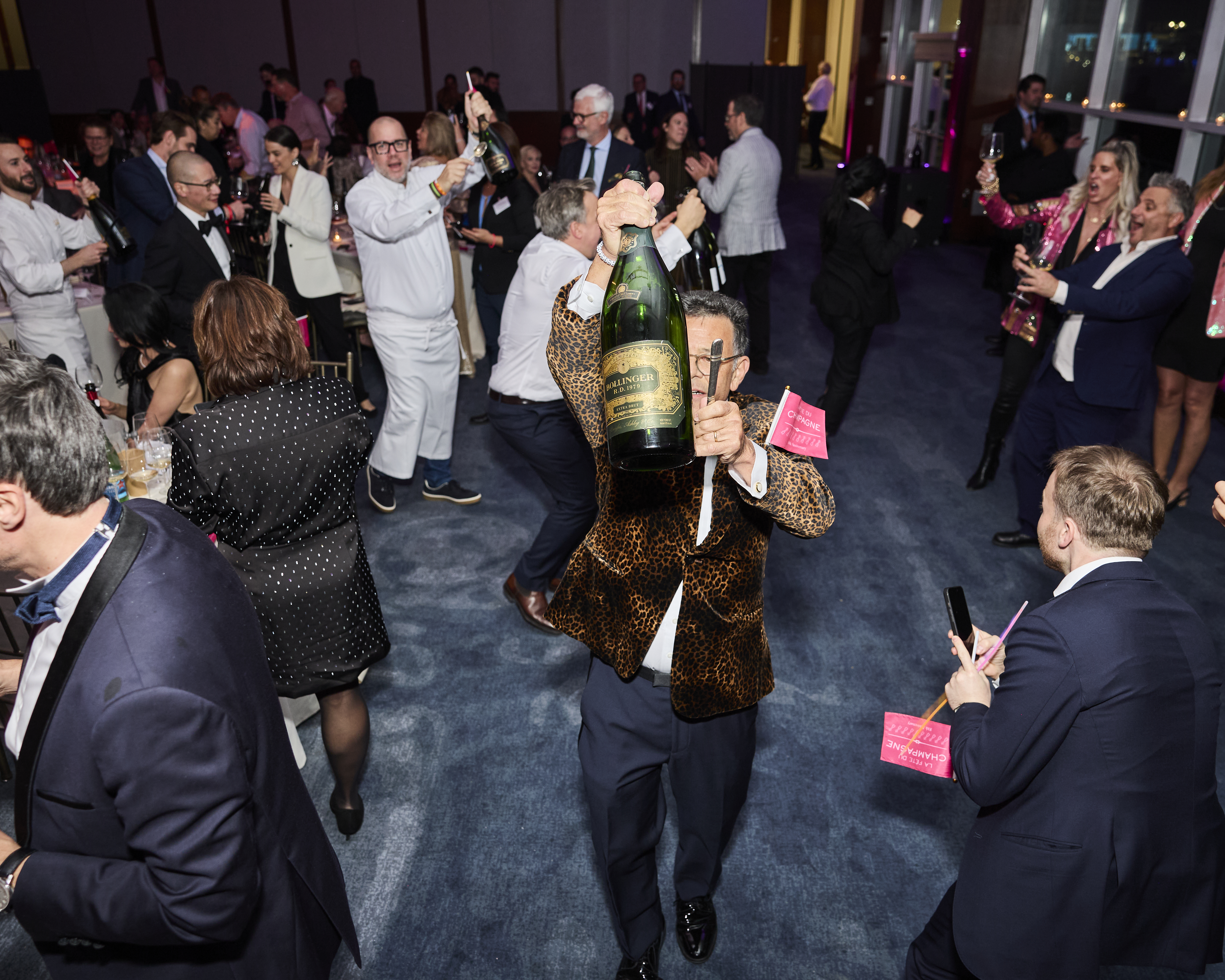 La Fete co-founder carries a magnum of Bollinger. Photo courtesy of @Jamescfrench