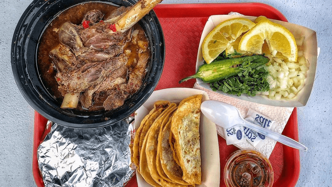 The heaping platter at Birrieria Barajas which included goat ribs and shoulder in consome, bean tacos and tortillas