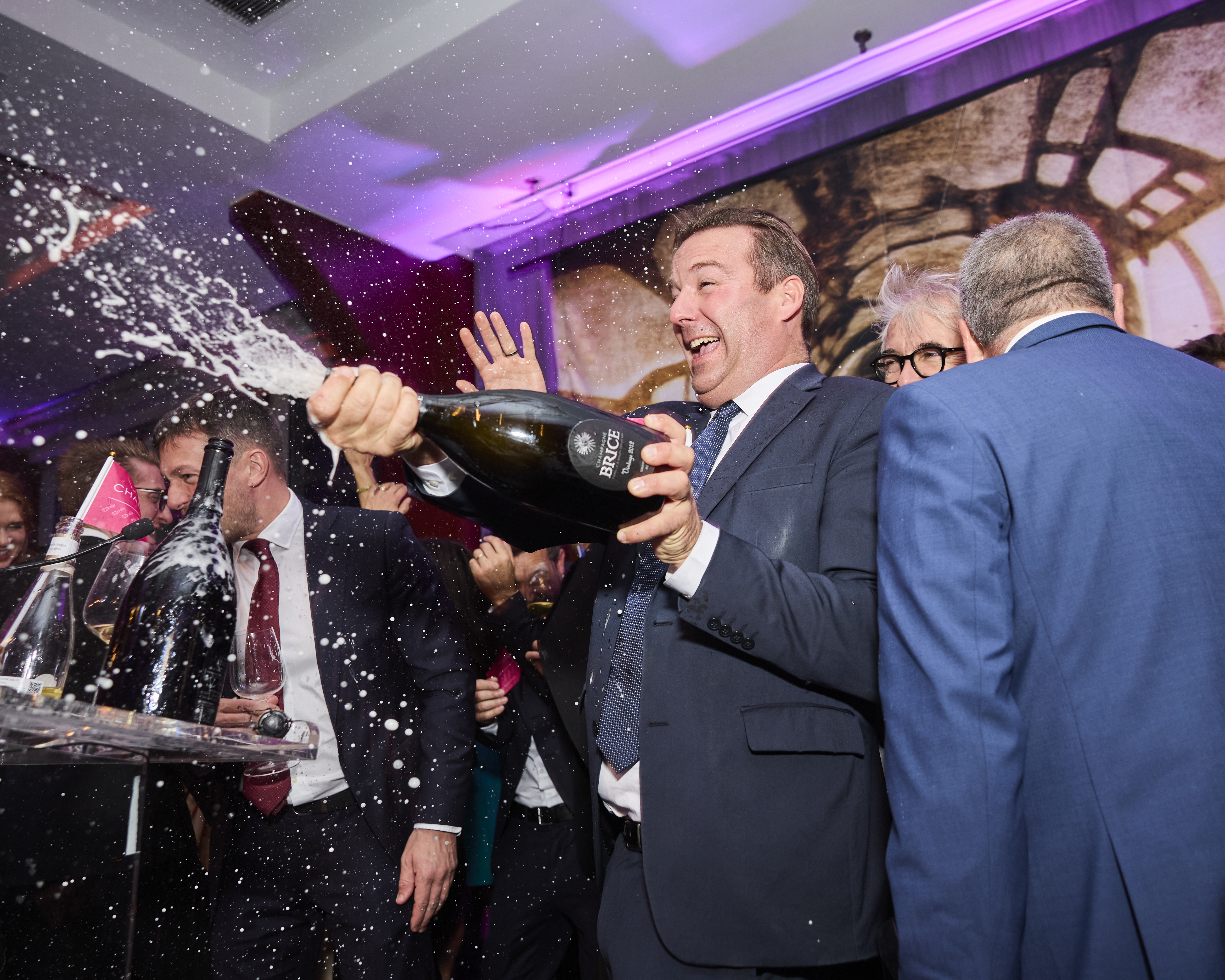 Champagne is sprayed at La Fete du Champagne 2024. Photo courtesy of @jamescfrench