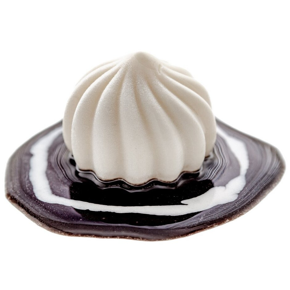 White, ridged dumpling-shaped dessert on a black and white marbled plate, set against a plain white background, evoking elegance.