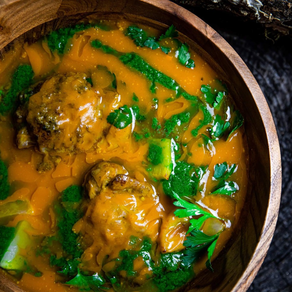 a bowl of orangish brown soup