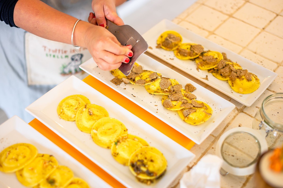 Shaving truffles onto Ravioli