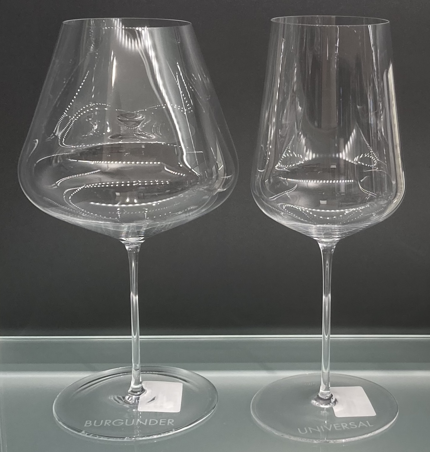 A Zalto Burgundy glass and Universal glass displayed together